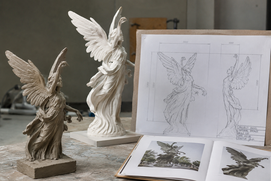 Contemporary marble sculpture concept model with design drawings before marble production