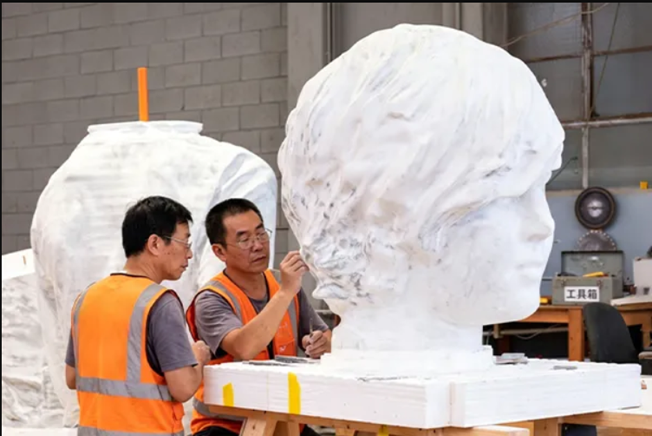 Pegasus sculptors refining a contemporary marble sculpture from the approved design concept