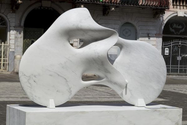 Completed abstract marble sculpture with a softly reflective surface. Source
