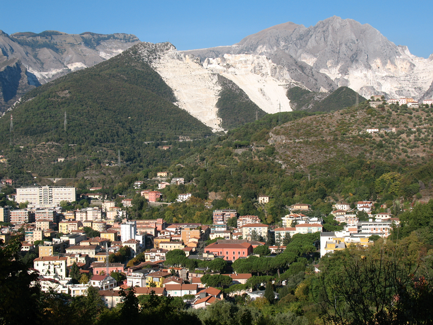 Carrara quarry landscape in Italy. A stone name describes a source family; buyers still need to approve the individual block selected for their sculpture.